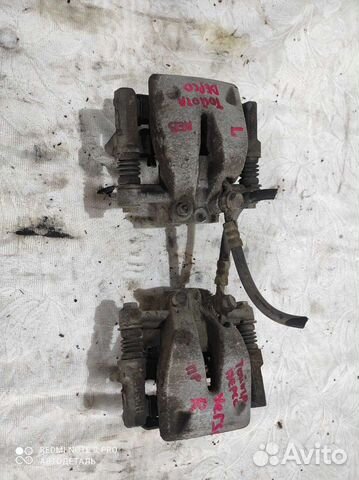 Суппорт В сборе toyota avensis corolla verso ADT25